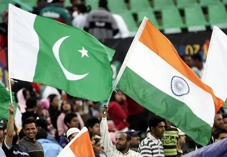 Indian and Pakistani flags fly side by side