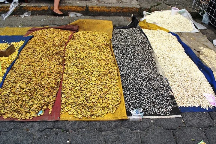 Haba beans, blue corn and white corn for sale at a local market
