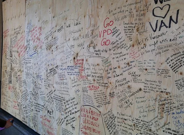 Words of support written by this morning's crowds. These messages fill every boarded up window in the downtown core.