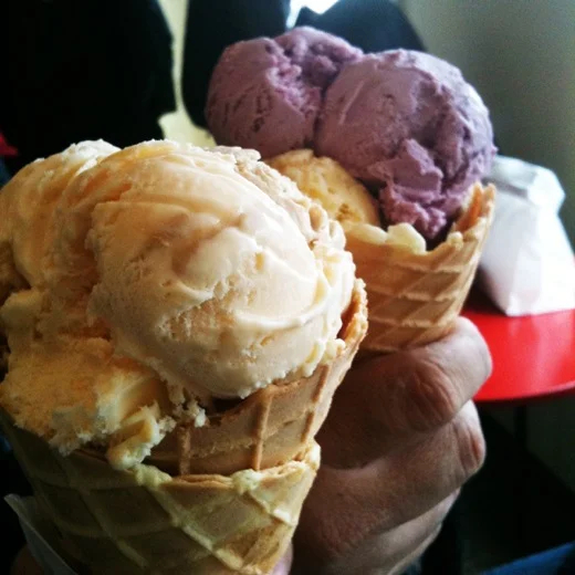 Giant scoops of ice cream on homemade waffle cones at Kapaw's