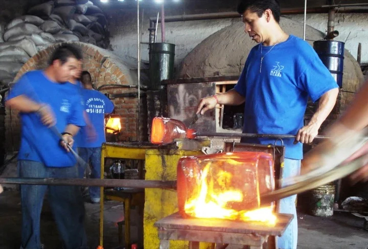Glass blowers at work in the studio