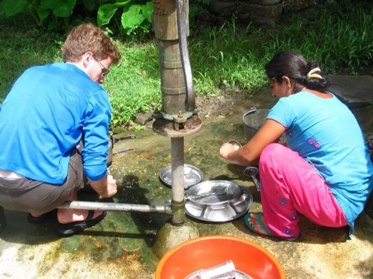 Helping the family wash-up in lowland Nepal