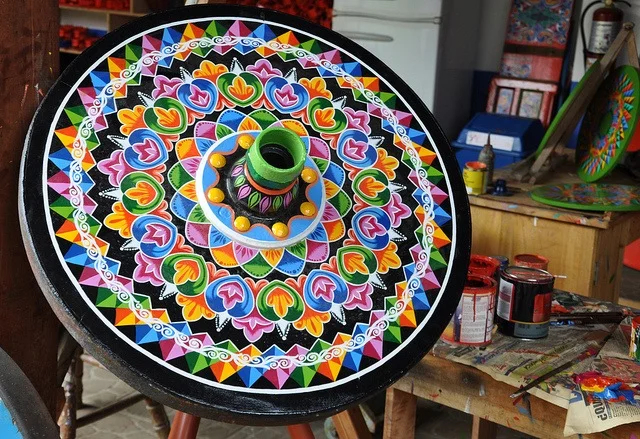 Traditional painted wagon wheel at Sarchi Village