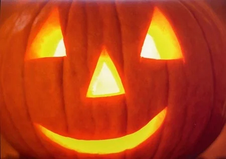 A jack 'o lantern glows