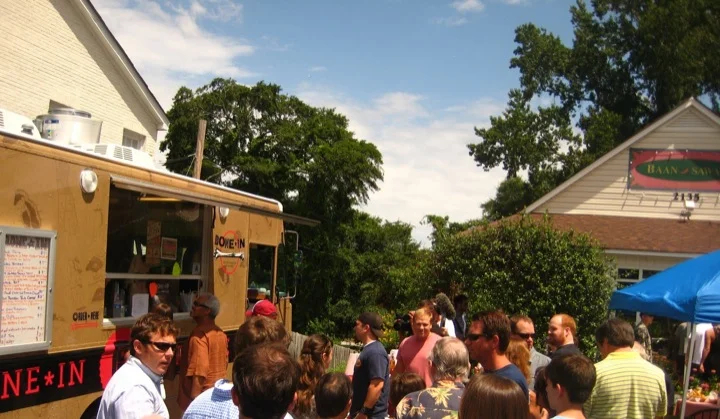 Crowds ordering from the Bone-In Artisan BBQ Truck
