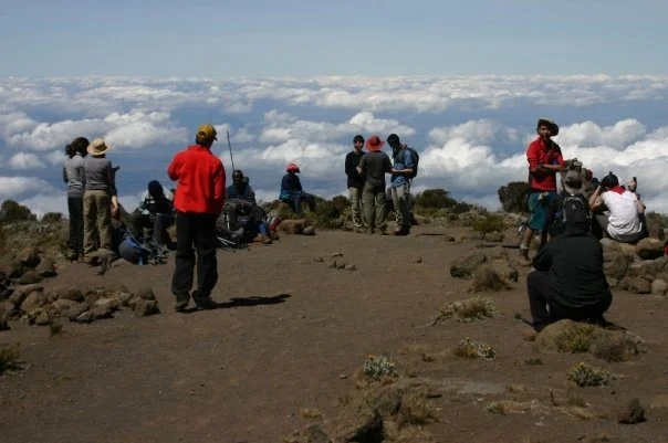 Hikers above the clouds on Kilimanjaro