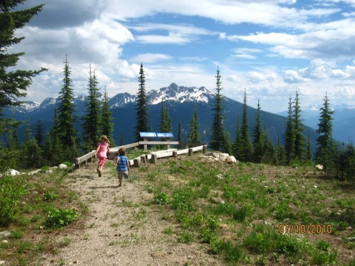 The children running add a dynamic element to this otherwise quiet landscape..