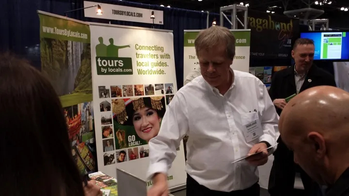 Guide Remo helping with the brochures (guide Michael in black suit)