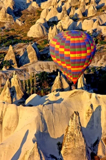 Hot air balloon flies over Cappadocia