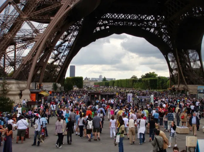 The Eiffel Tower is beautiful from a distance. But up close...it's the crowds we notice!