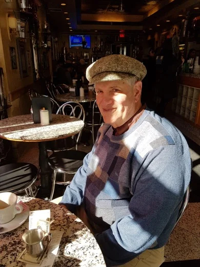 TBL Guide Alan pausing for coffee in Vittoria's Cafe