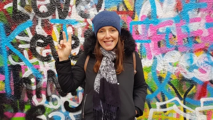 Nora at the John Lennon Wall