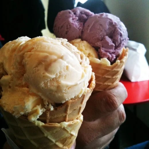 Giant scoops of ice cream on homemade waffle cones at Kapaw's