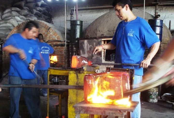 Glass blowers at work in the studio