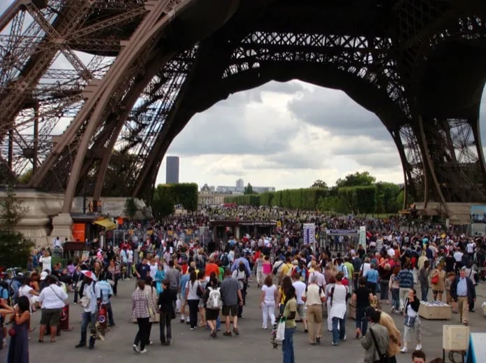 The Eiffel Tower is beautiful from a distance. But up close...it's the crowds we notice!