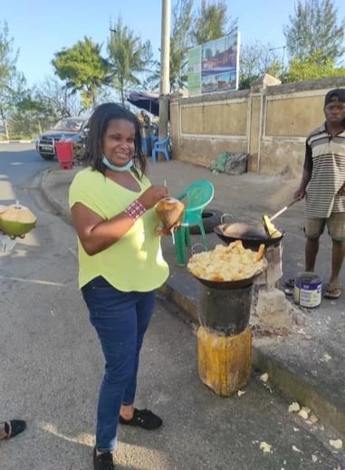 sampling street food in the coastal town Mombasa , with some Mandafu 