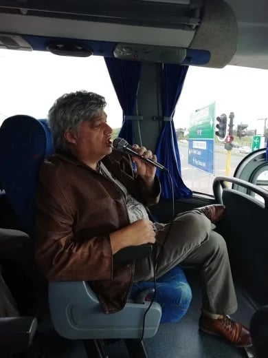 Doing my commentary on a coach during a Durban city tour.