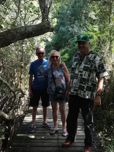 Enjoying a stroll along the board walk in St Lucia with my British tourists.