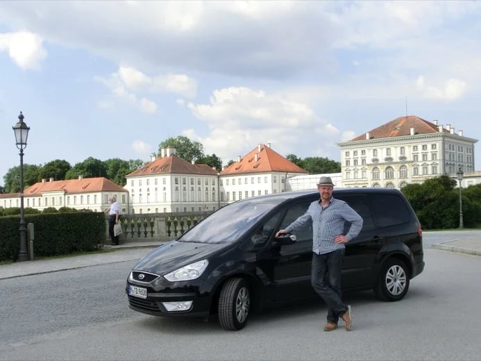 Driver Guide Thomas D. and his Ford Galaxy in front of Nymphenburg Palace Munich