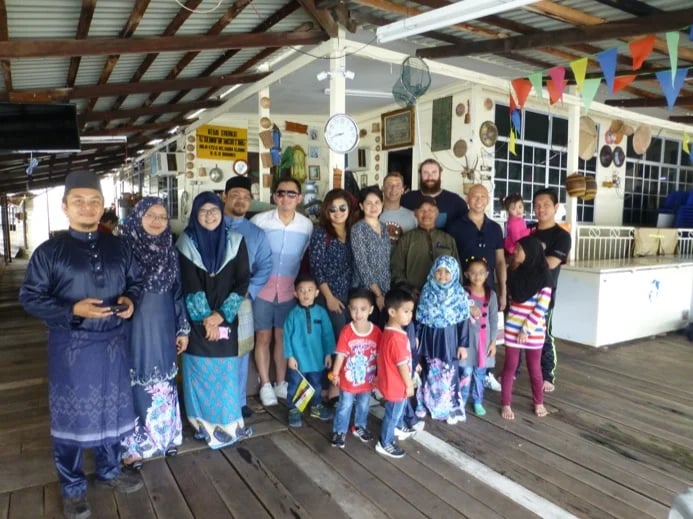 Posing for a group photo with my tour guests at the house of my Malay friends in Kampong Ayer