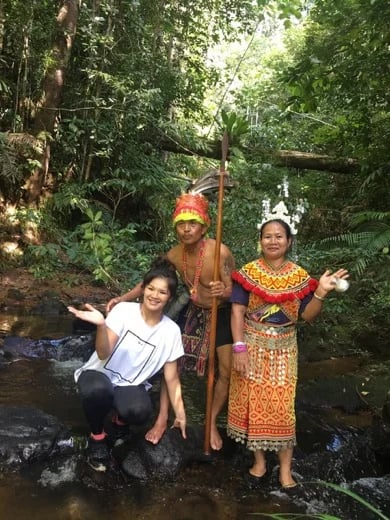 Hanging out with my Iban friends in traditional dress from the remote jungle area of Brunei