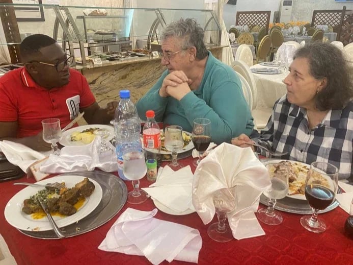 travellers eating local meal