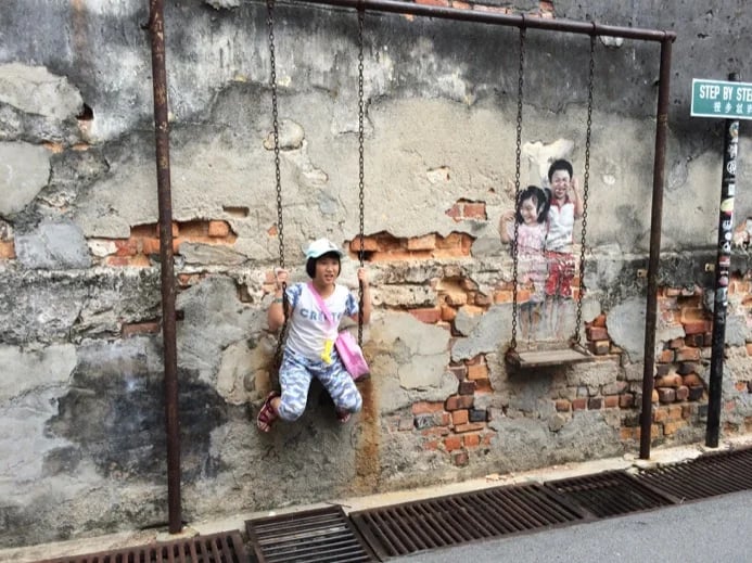 Street Art - Boy and Girl on Swing