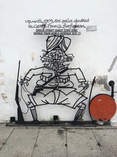Penang Iron Sculpture that tells a story - Fireman or Policeman??