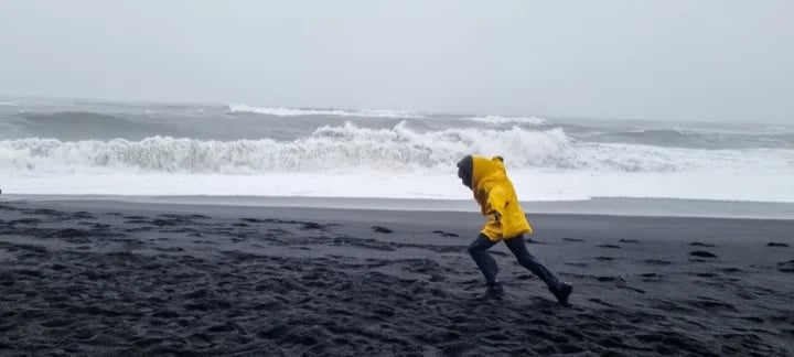Fighting the wind at Reynisfjara, black sand beach