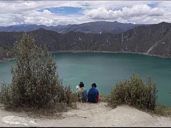 Bright turquoise water lagoon and crater of Quilotoa