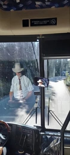 Sometimes my passengers like to sneak pictures of me while driving the tour coach. Here I am taking a great group of Germans to visit Moraine Lake in Banff National Park summer 2023