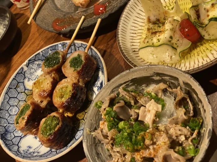 Pork-wrapped skewered vegetables and assorted dishes