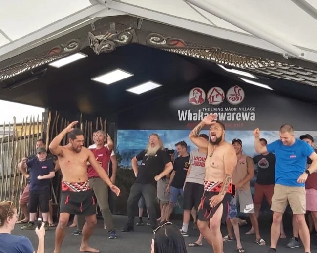 Having fun being involved in the performance at the living maori village.