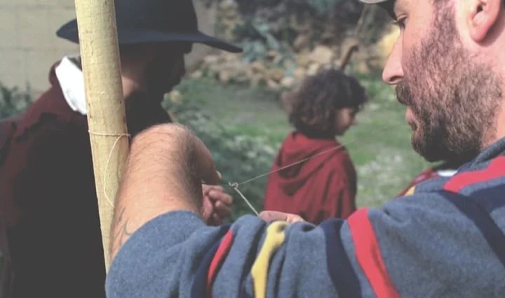 As a reenactor you learn how things used to be done. Here, preparing a fish net like used to be done in the middle ages