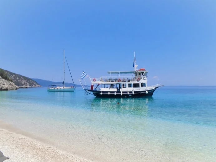 Cruise boat waiting for hikers at Koutsoupia beach.