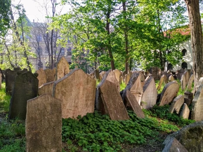 and through Old Jewish Cemetery, where, besides thousands of unknowns, many outstanding members of the Jewish community are buried ... rabbis, scholars, writers, financiers