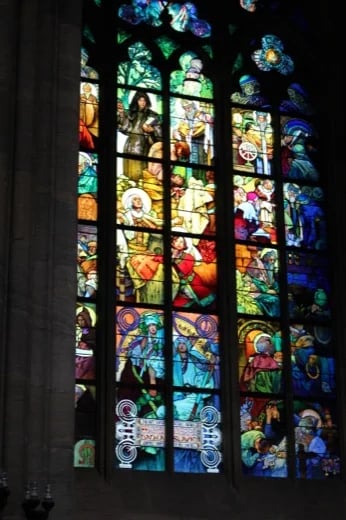 famous for its stained glass windows according to the designs of prominent Czech artists of the 19th century such as Alphons Mucha