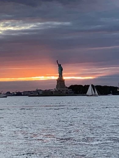 The Statue of Liberty at sunset taken from the Staten Island Ferry
