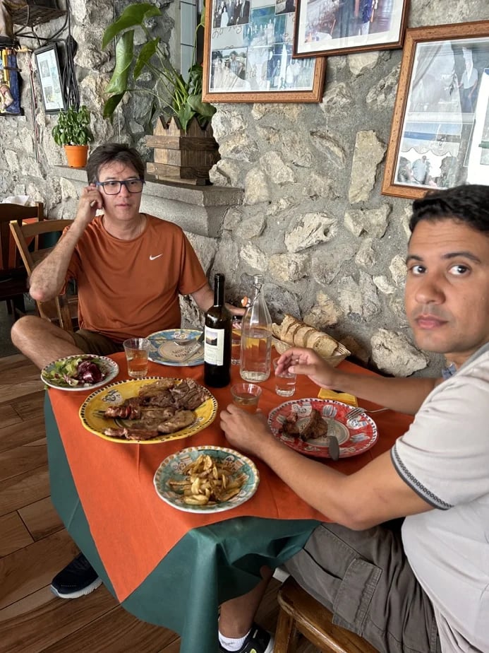 Brasilian guest having steak and wine in Positano