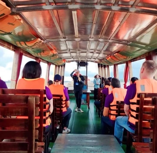 Talking to Travellers in Mekong Boat Trip from Saigon