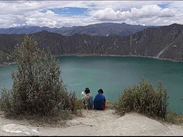 Bright turquoise water lagoon and crater of Quilotoa