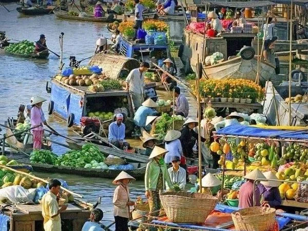 Explore the biggest floating market in the Mekong Delta